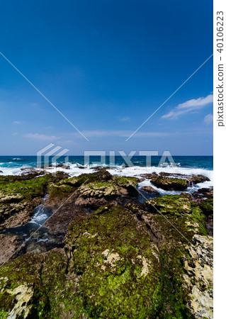 An uplifting coral reef island with a limestone coastline of coral origin An uplifting coral reef island with a limestone coastline of coral origin 40106223