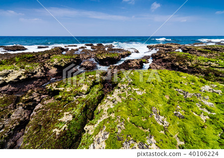 An uplifting coral reef island with a limestone coastline of coral origin An uplifting coral reef island with a limestone coastline of coral origin 40106224