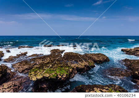 An uplifting coral reef island with a limestone coastline of coral origin An uplifting coral reef island with a limestone coastline of coral origin 40106234