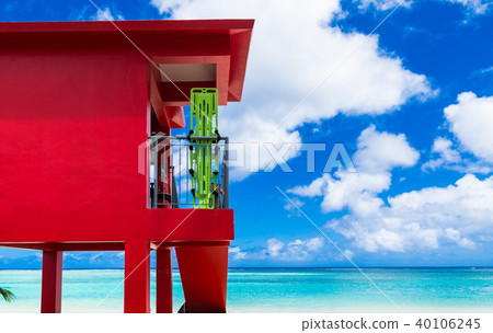 Tropical beach and red guard platform Guam 40106245