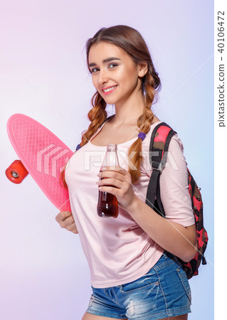 beautiful woman with skate in studio 40106472