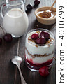 Cherry yoghurt with muesli, milk and honey 40107991