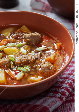 Lentil soup with meatballs macro shot 40107995