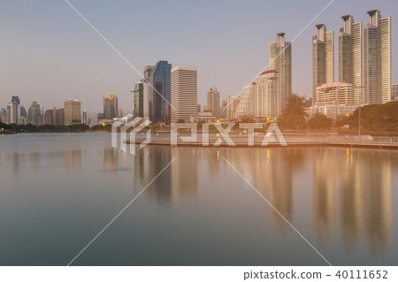 Reflection office building on water lake  40111652