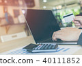 businessman hands holding credit card on computer 40111852