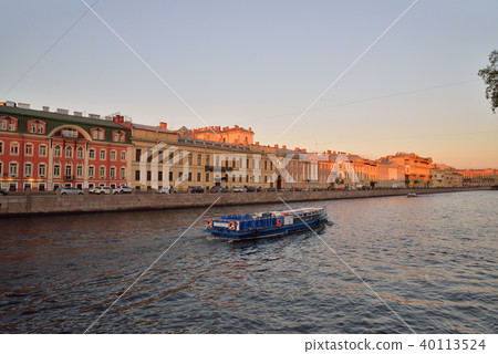 Pleasure boat on the Fontanka river at sunset Pleasure boat on the Fontanka river at sunset 40113524