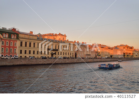 Pleasure boat on the Fontanka river at sunset Pleasure boat on the Fontanka river at sunset 40113527