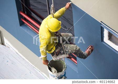painters painting color on building wall. painters painting color on building wall. 40114662