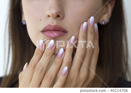 Beautiful woman's nails with french manicure ombre Beautiful woman's nails with french manicure ombre 40114706