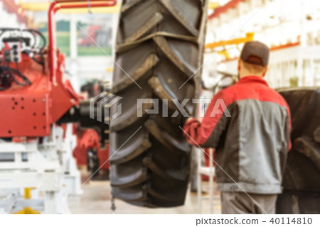 Blurred image of industrial worker at plant Blurred image of industrial worker at plant 40114810