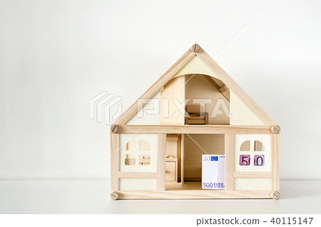 Wooden house model with 500 euro bill. House Wooden house model with 500 euro bill. House 40115147