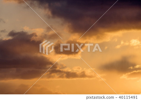 Colorful sunset with fluffy clouds in the sky Colorful sunset with fluffy clouds in the sky 40115491