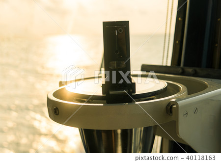 Close up of nautical marine magnetic compass on yacht or boat Close up of nautical marine magnetic compass on yacht or boat 40118163