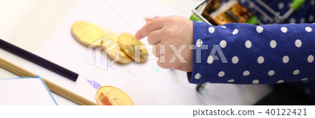 Little girl arm collecting crypto coins 40122421