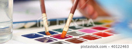Brush point in watercolor paint closeup Brush point in watercolor paint closeup 40122463