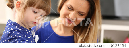 Blond smiling little girl hold in arm brush Blond smiling little girl hold in arm brush 40122464