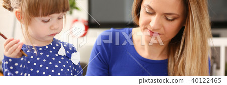 Blond smiling little girl hold in arm brush 40122465