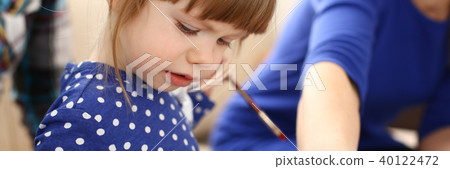 Blond smiling little girl hold in arm brush Blond smiling little girl hold in arm brush 40122472