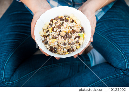 Girl with a plate of muesli 40123902