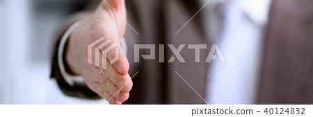 Man in suit and tie give hand as hello Man in suit and tie give hand as hello 40124832