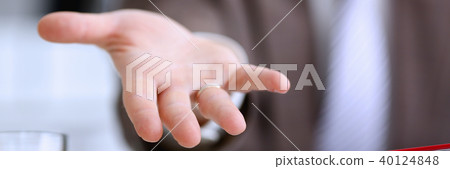 Male in suit and tie offer helping arm closeup 40124848