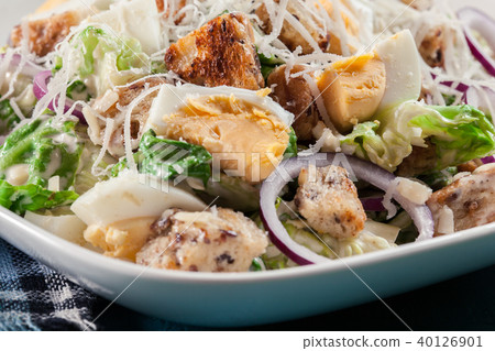 Caesar salad with cheese, eggs and croutons 40126901