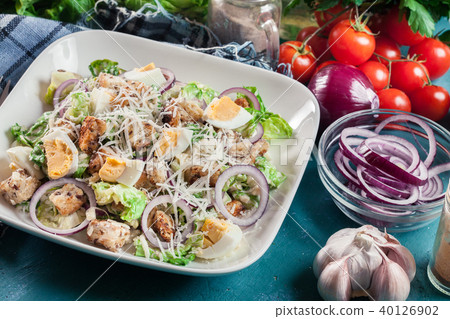 Caesar salad with cheese, eggs and croutons 40126902