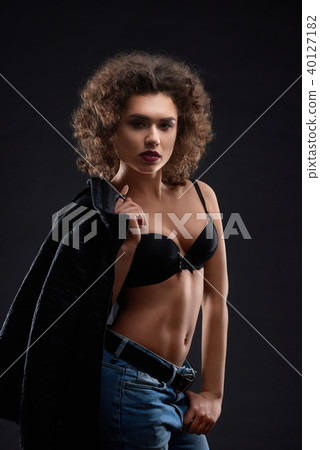 Sexy woman in black bra and blue jeans. Sexy woman in black bra and blue jeans. 40127182