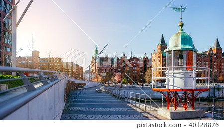 Panorama of Hafencity with old beacon lighthouse and red brick building in background, Speicherstadt 40128876