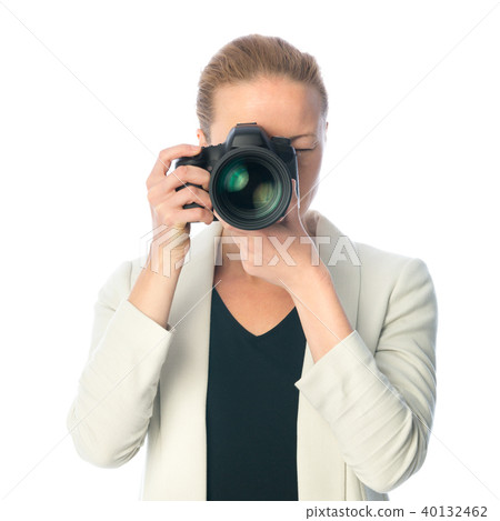 Beautiful young photographer with camera in professional studio 40132462