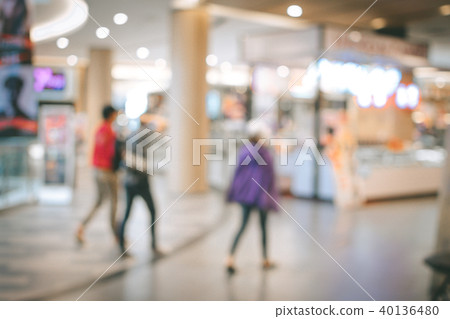 Blurred image people and bookshelves in library Blurred image people and bookshelves in library 40136480