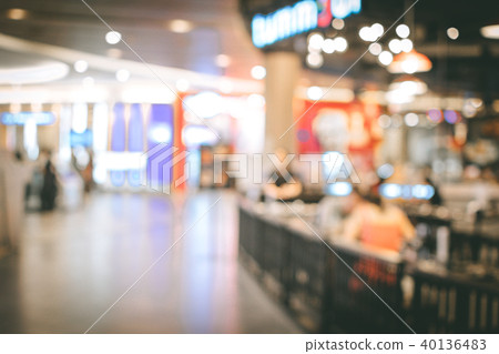 Blurred image people and bookshelves in library Blurred image people and bookshelves in library 40136483