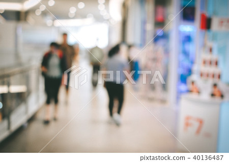 Blurred image people and bookshelves in library Blurred image people and bookshelves in library 40136487