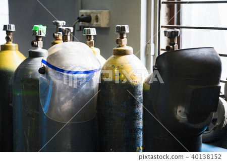 gas cylinders and protection mask in workshop gas cylinders and protection mask in workshop 40138152
