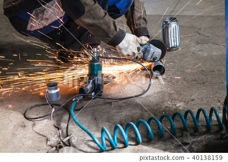 mechanic cuts new pipe for corrugation silence mechanic cuts new pipe for corrugation silence 40138159