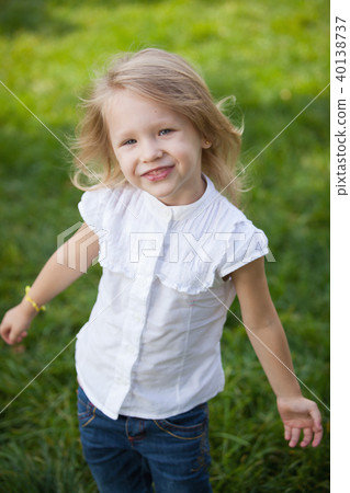 Happy smiling little girl in a summer park 40138737