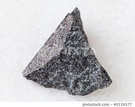 rough olivinite stone on white 40139377