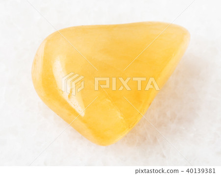polished yellow Aventurine gem stone on white polished yellow Aventurine gem stone on white 40139381