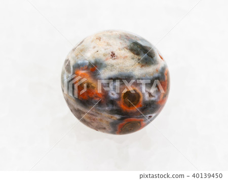 tumbled orbicular jasper gemstone on white marble tumbled orbicular jasper gemstone on white marble 40139450