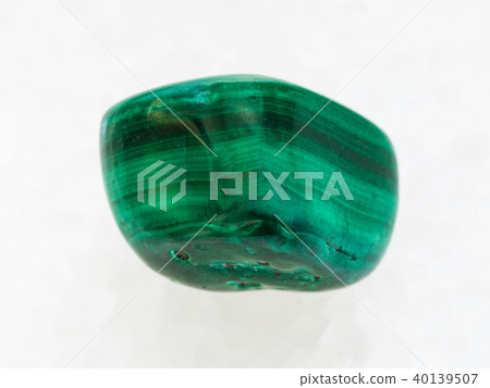 tumbled Malachite gemstone on white marble tumbled Malachite gemstone on white marble 40139507