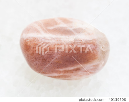 tumbled moonstone gemstone on white marble 40139508