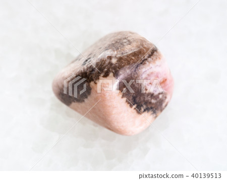 polished Rhodochrosite gemstone on white 40139513
