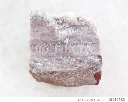 rough Rhyolite stone on white marble rough Rhyolite stone on white marble 40139583