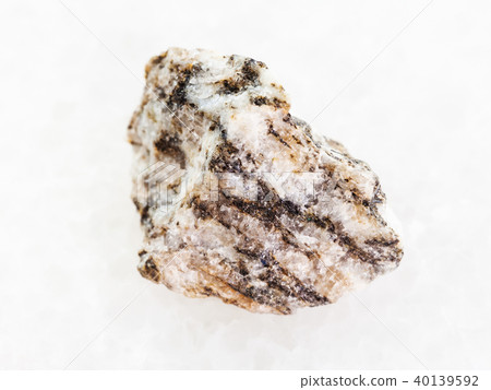 raw Gneiss stone on white marble 40139592