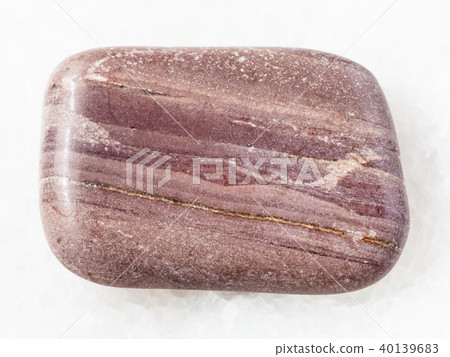 polished Argillite gemstone on white marble 40139683