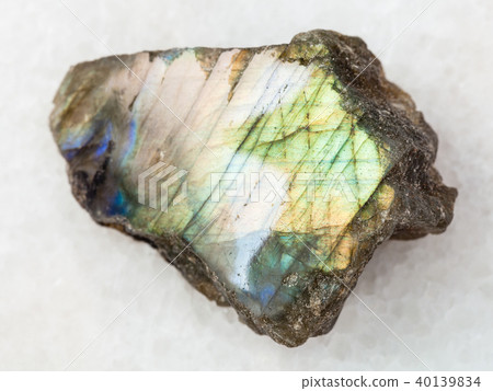 polished slab of labradorite stone on white marble polished slab of labradorite stone on white marble 40139834