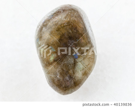 polished labradorite gem stone on white marble polished labradorite gem stone on white marble 40139836