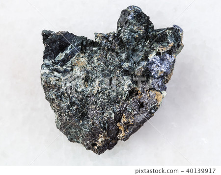 Molybdenite crystal in rough Glaucophane on white Molybdenite crystal in rough Glaucophane on white 40139917