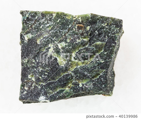raw dunite stone on white raw dunite stone on white 40139986