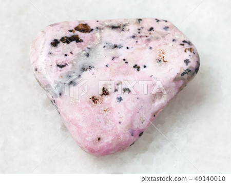 tumbled rhodochrosite gem on white 40140010